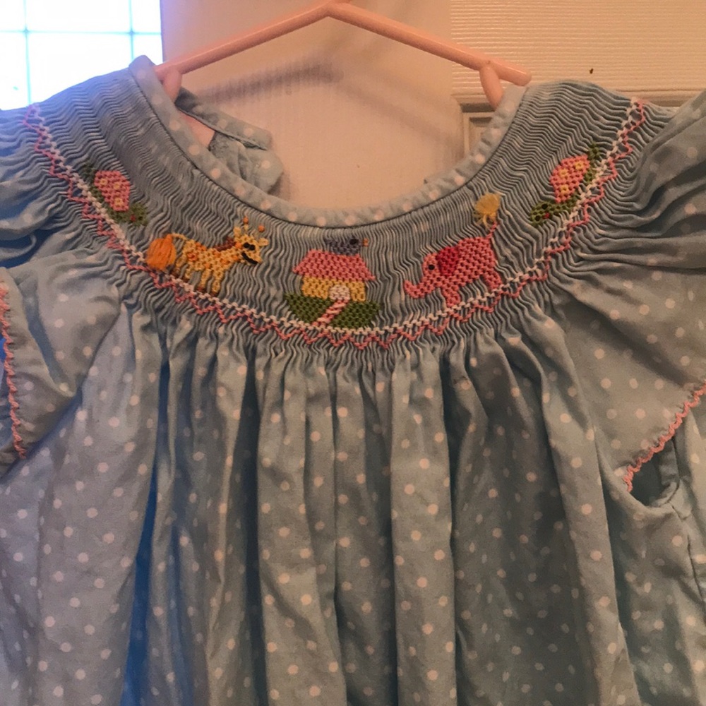 Petit Belle smocked dress. Noah’s Ark theme.